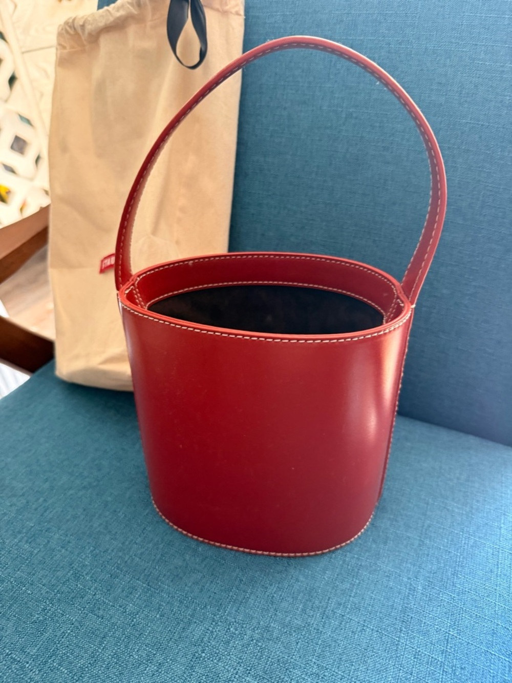 STAUD Red Bucket drawstring and dust cover with red STAUD logo.